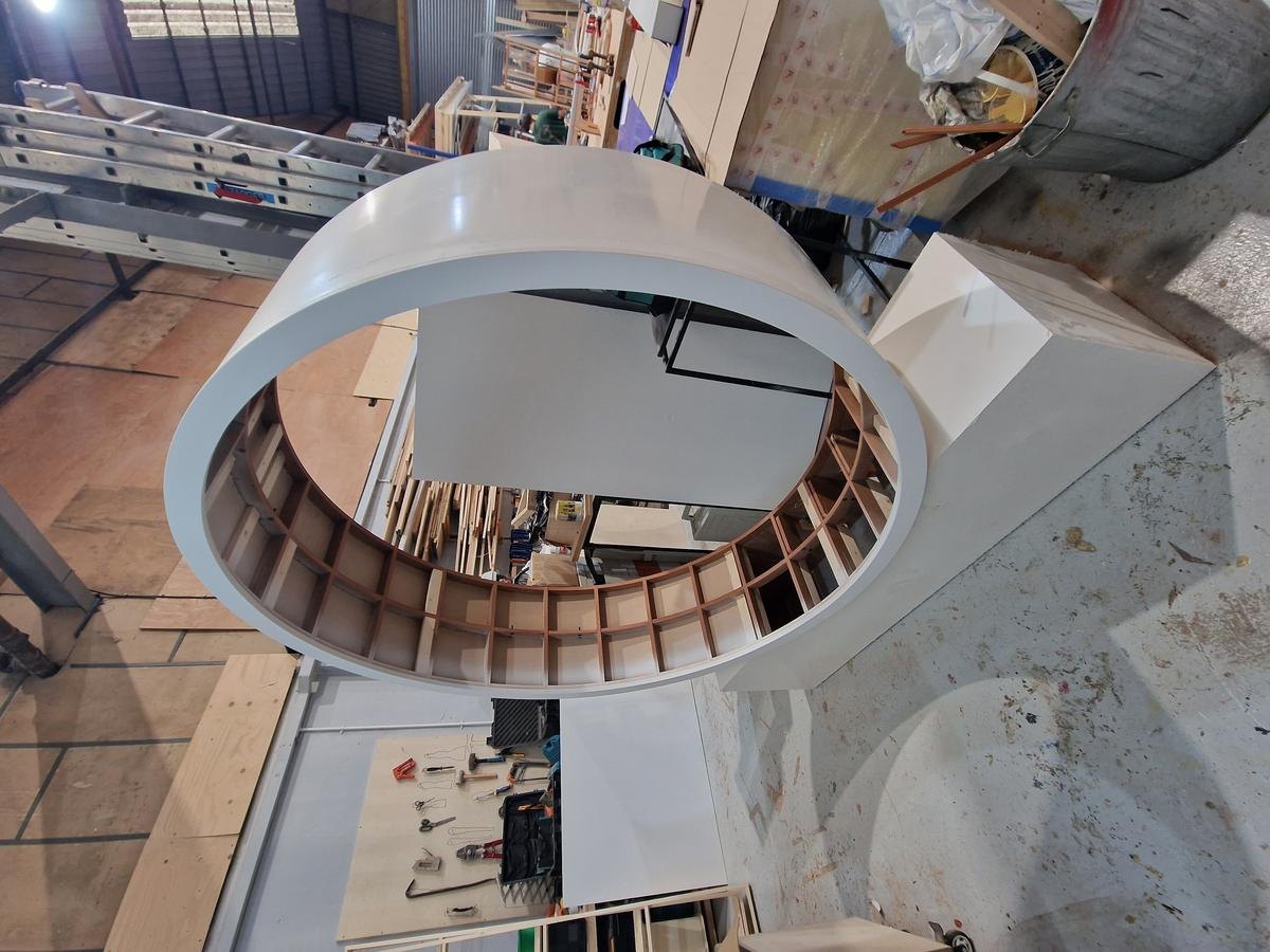 Large white CNC cut circular portal structure for a set build at the Rule One CNC workshop London