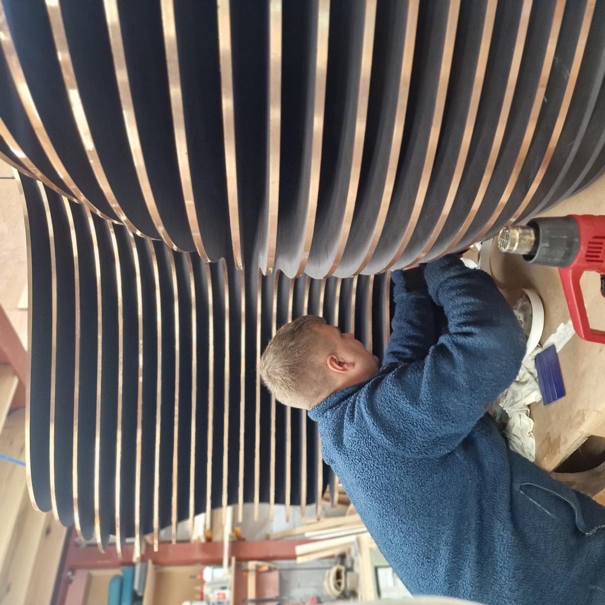 Large CNC cut MDF stacked columns being assembled for a set design at the Rule One CNC workshop, East London