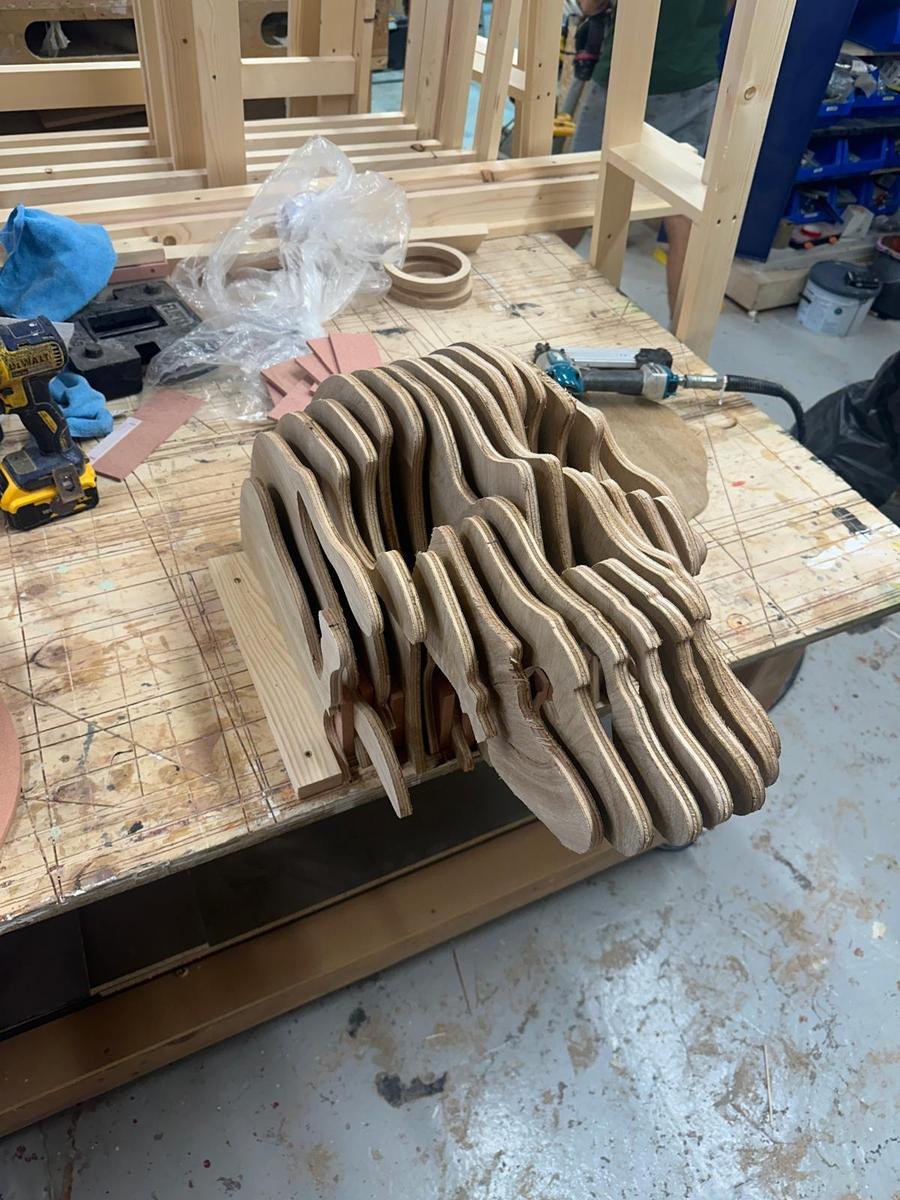 Stacked plywood contour layers CNC cut into a 3D form assembly by Rule One CNC
