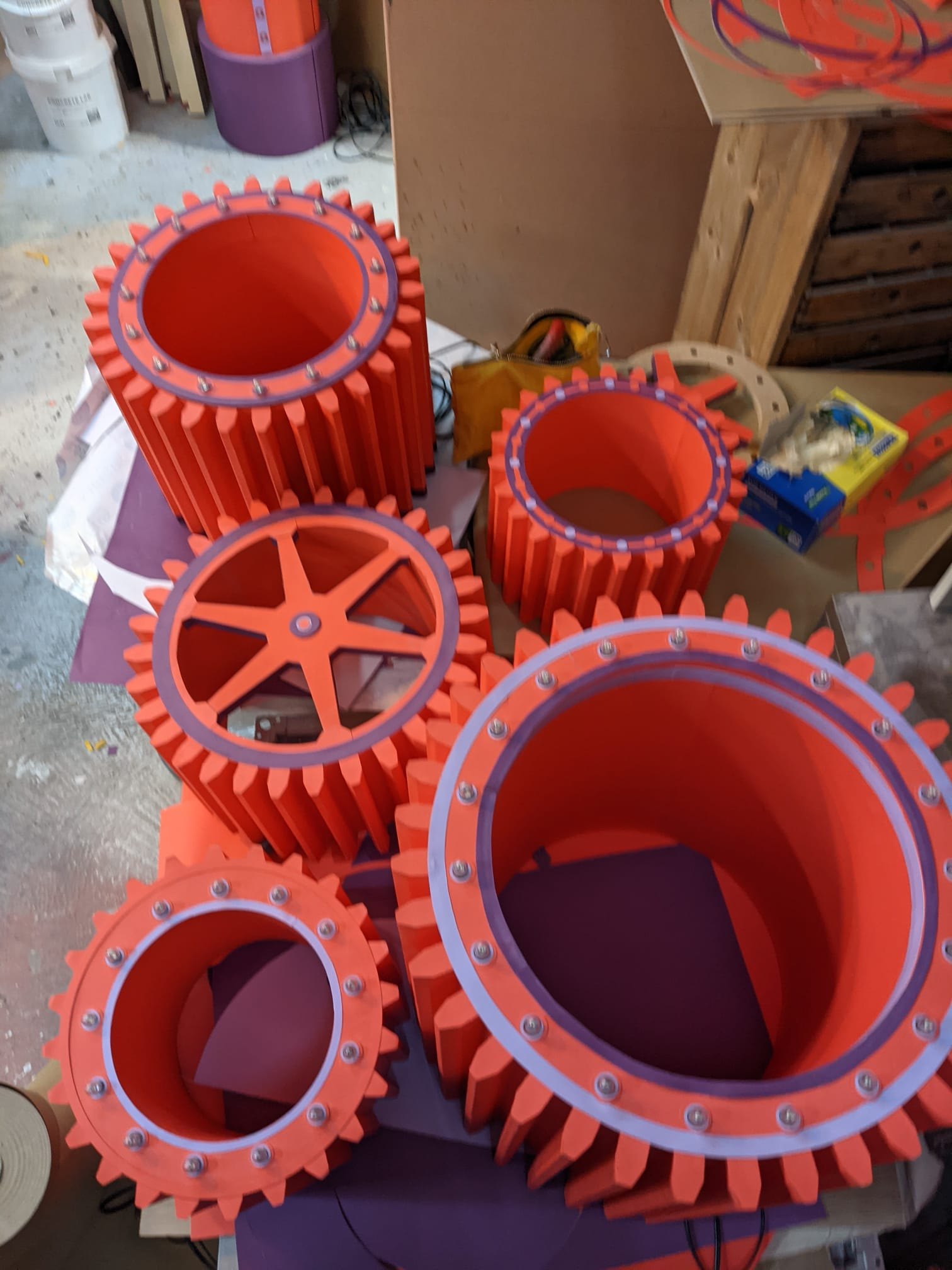 Large CNC routed foam gears and cog assemblies machined for a theatre set design