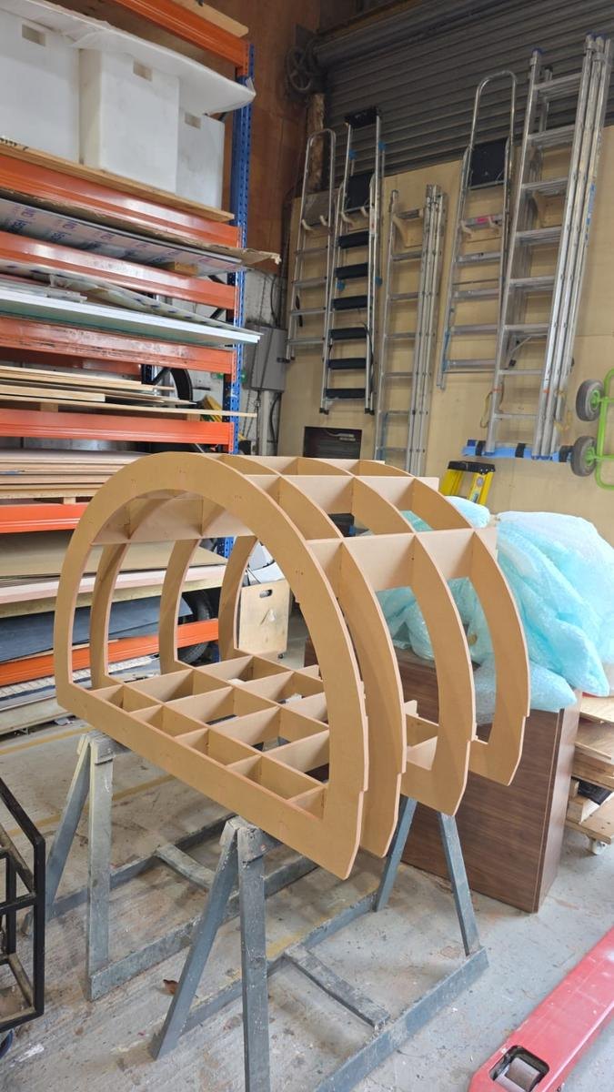 CNC routed circular interlocking plywood parts, precision cut from a full sheet
